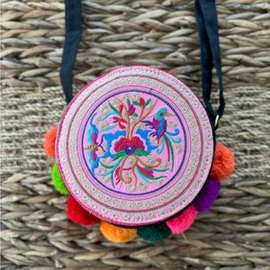 Round crossbody embroidered handbag